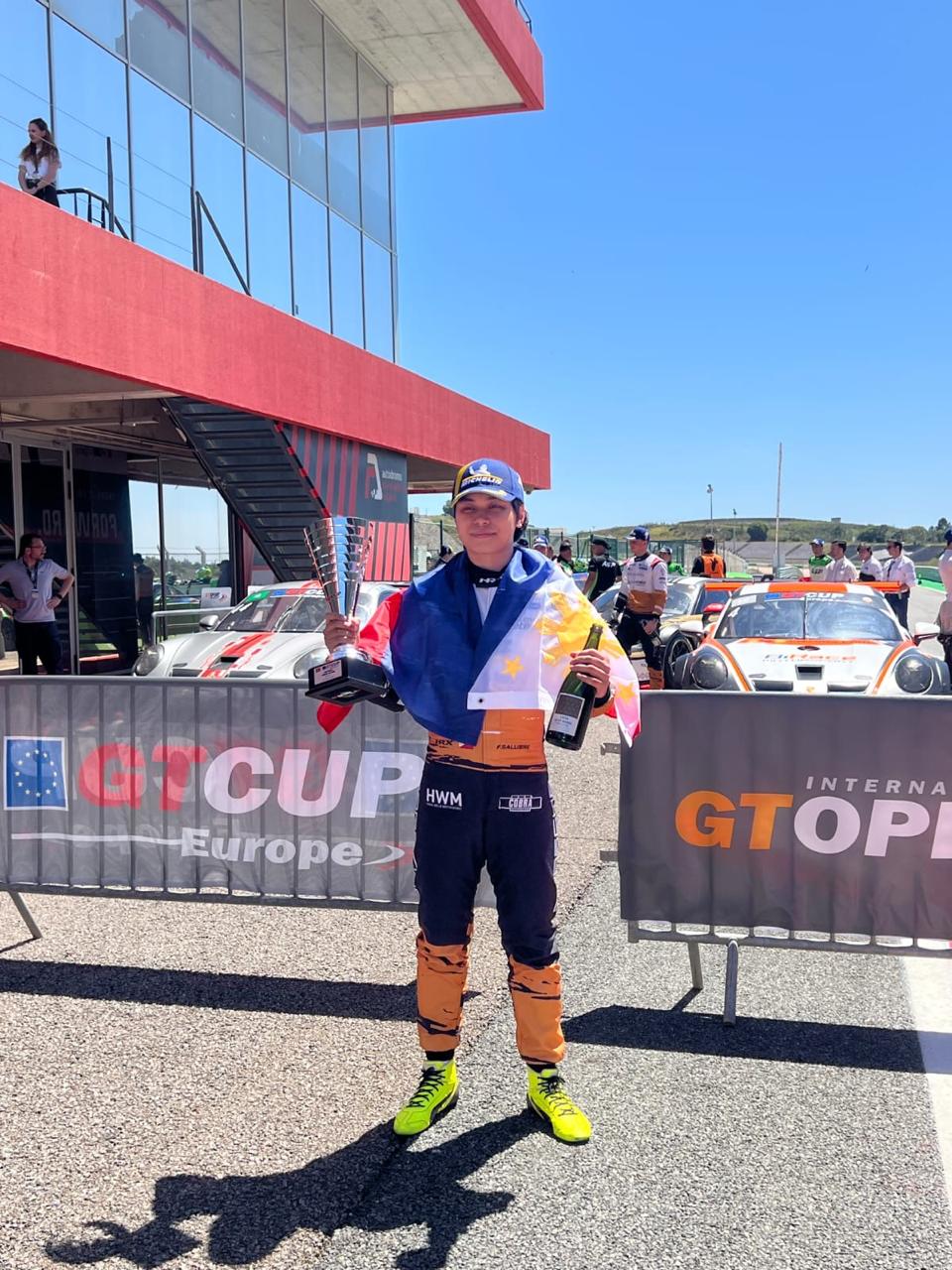 Fgani Angelo Salubre with the Philippine flag on the Portimão podium, 19 April 2026